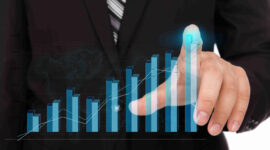 Business man pressing high tech type of modern graph on a virtual background