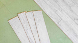 laminated flooring boards on gray background