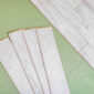 laminated flooring boards on gray background