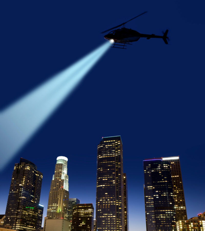 Police helicopter with strong searchlight.